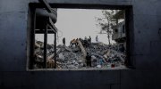 Palestinians search a house after an Israeli air strike, in the city of Rafah, southern of the Gaza Strip, on October 15 2023.